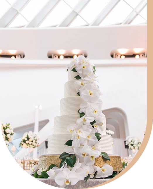 Four Tiered Wedding Cake with White Colored Flower